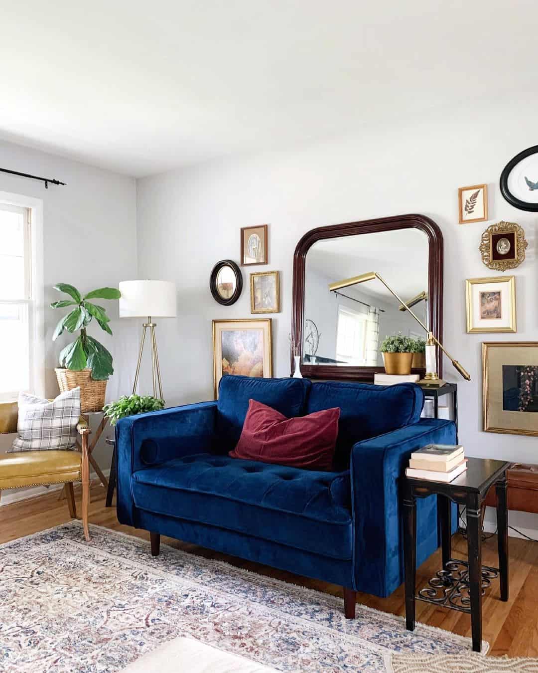 Gallery Wall Above Blue Sofa Creates an Artful Focal Point
