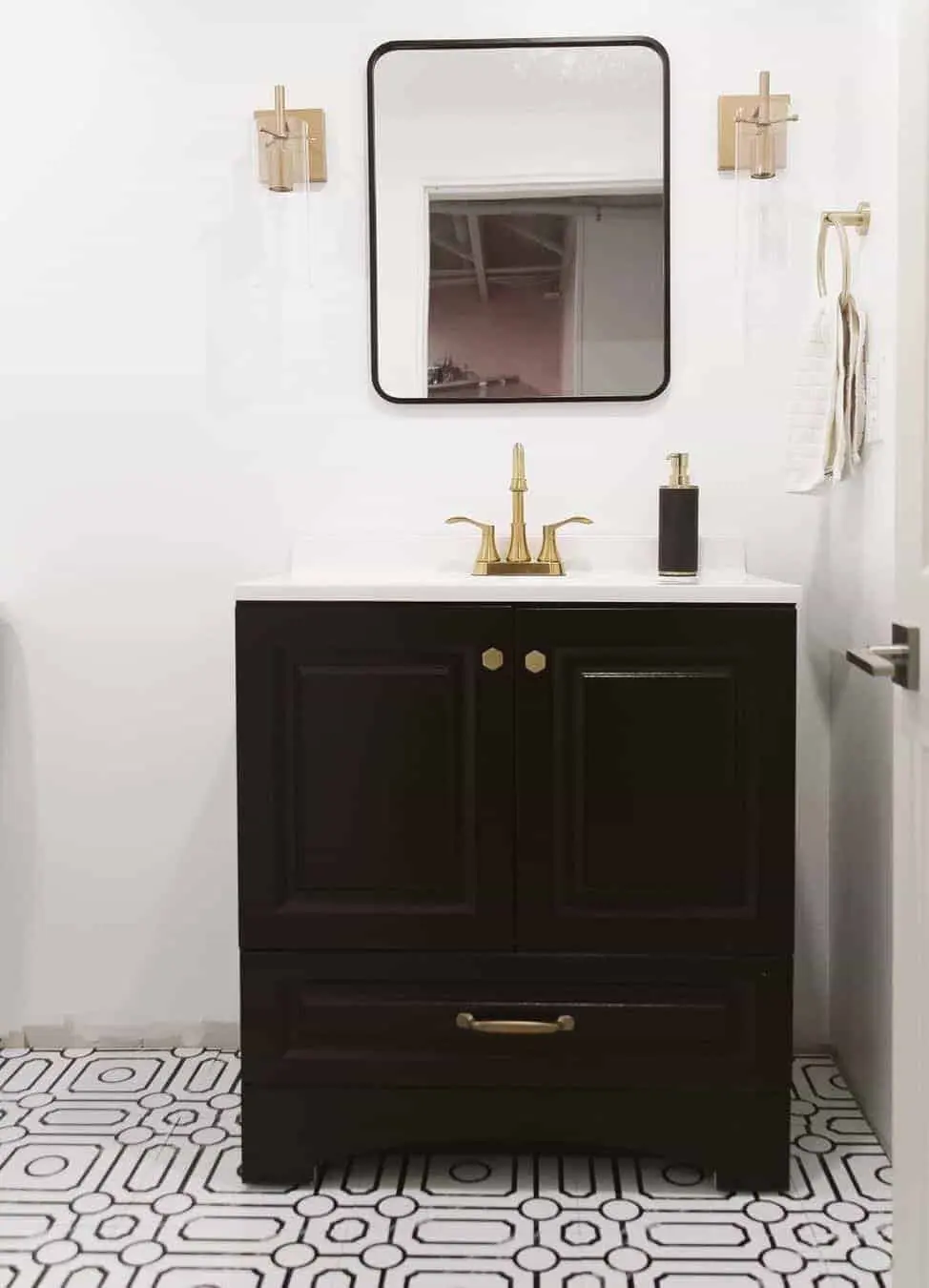Dark Wood Vanity Paired with Geometric Tile Flooring