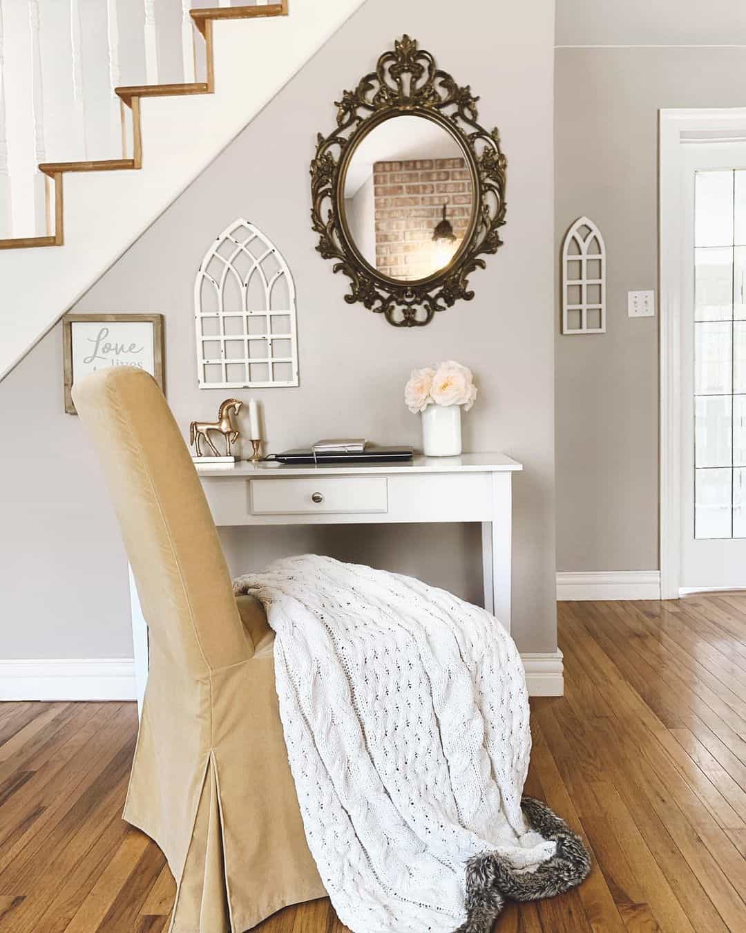 Ornate Mirror Adds Vintage Charm Above a Slim Desk