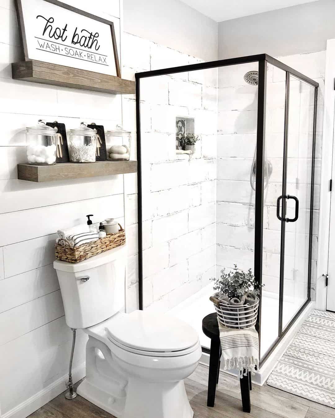 Black Framed Glass Shower Enclosure Defines the Space