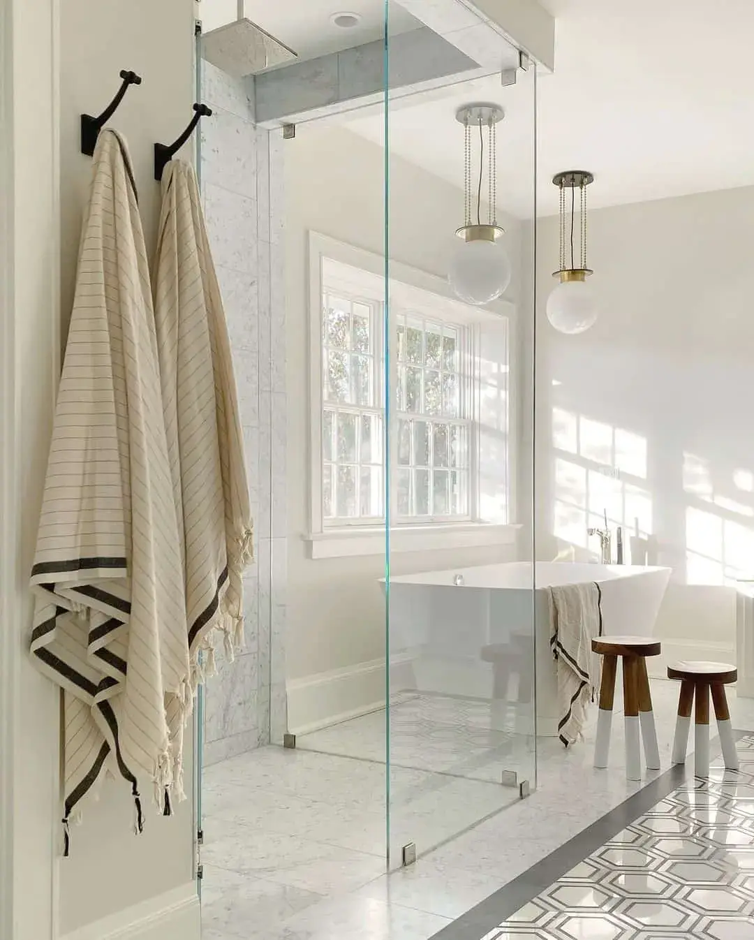 Geometric Floor Tiles Frame the Walk-In Shower