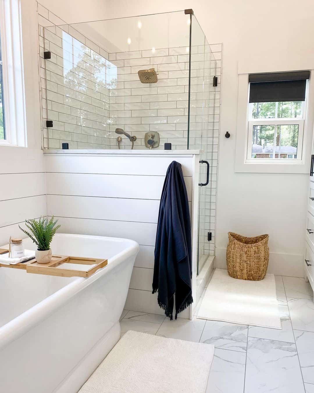 Brass Fixtures Add Warmth to White Subway Tile Shower