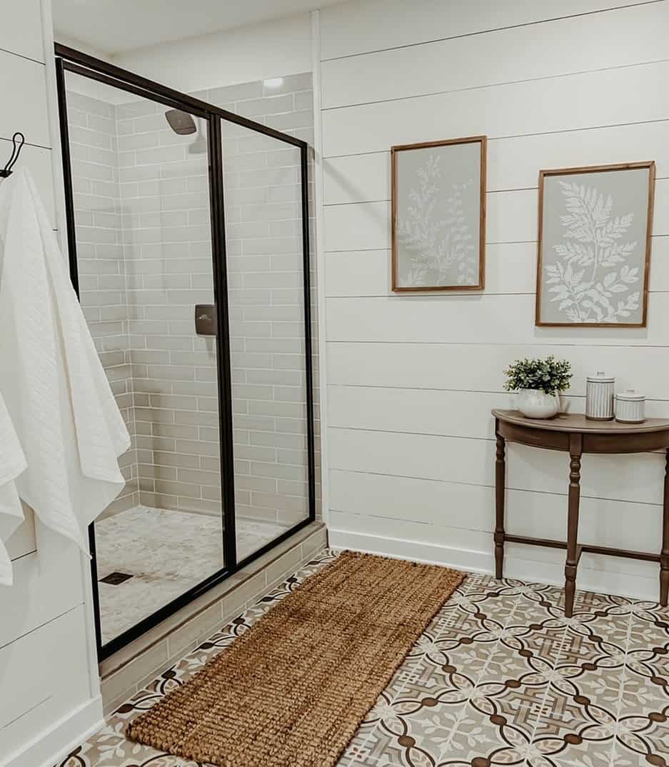 Subtle Gray Subway Tile Walls Complement Patterned Floor