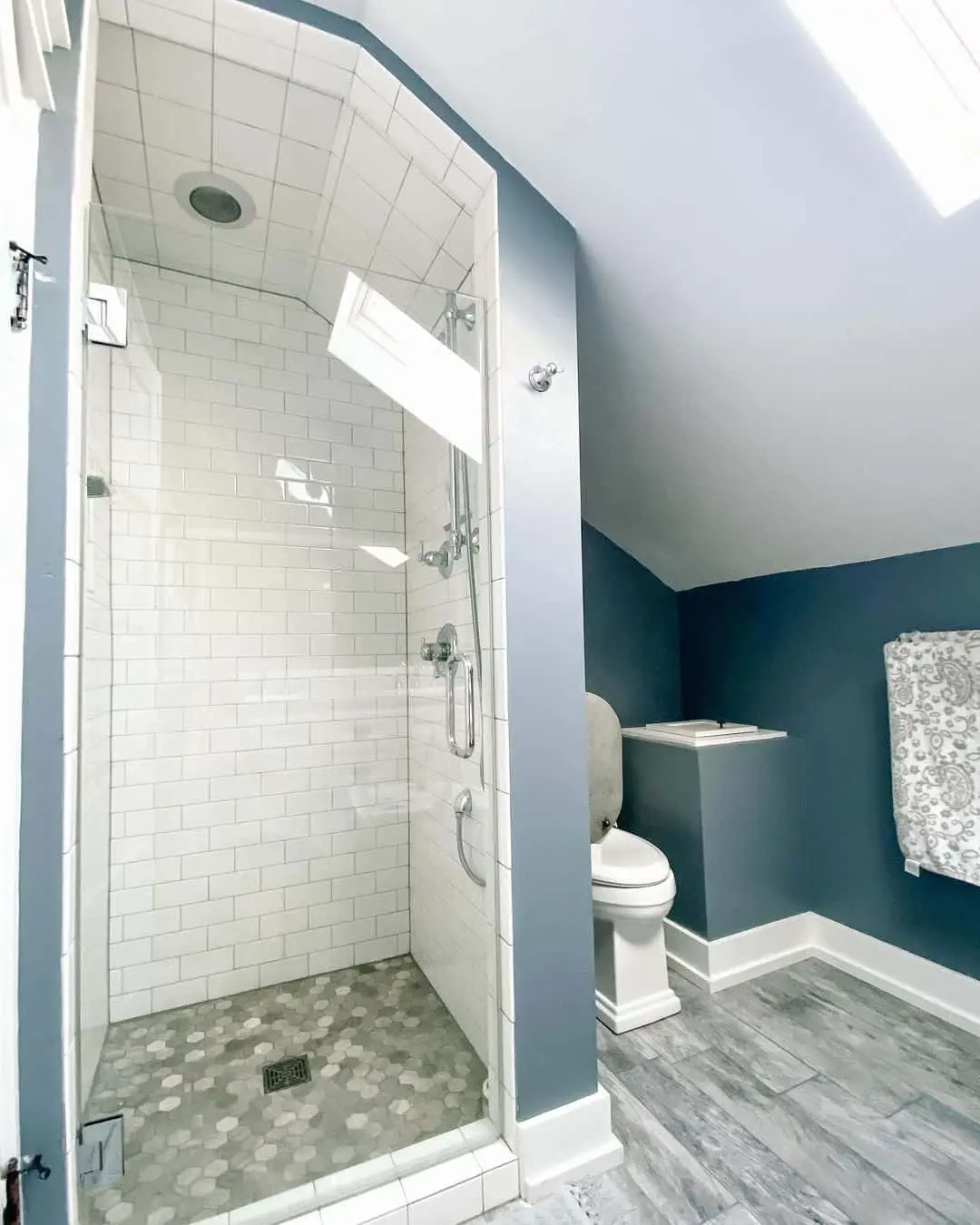 Hexagon Floor Tiles Add Subtle Pattern to White Subway Shower Walls