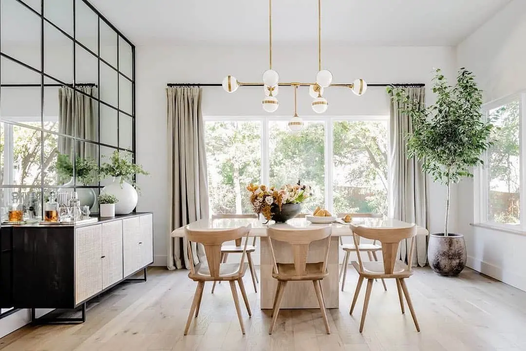 Anchor Your Space with a Light Wood Table and Sculptural Chairs