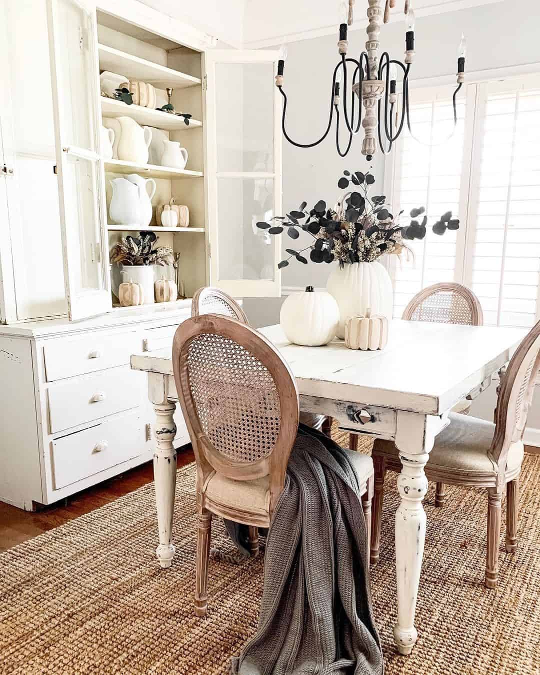 Vintage Charm with a Distressed White Table and Cane Back Chairs