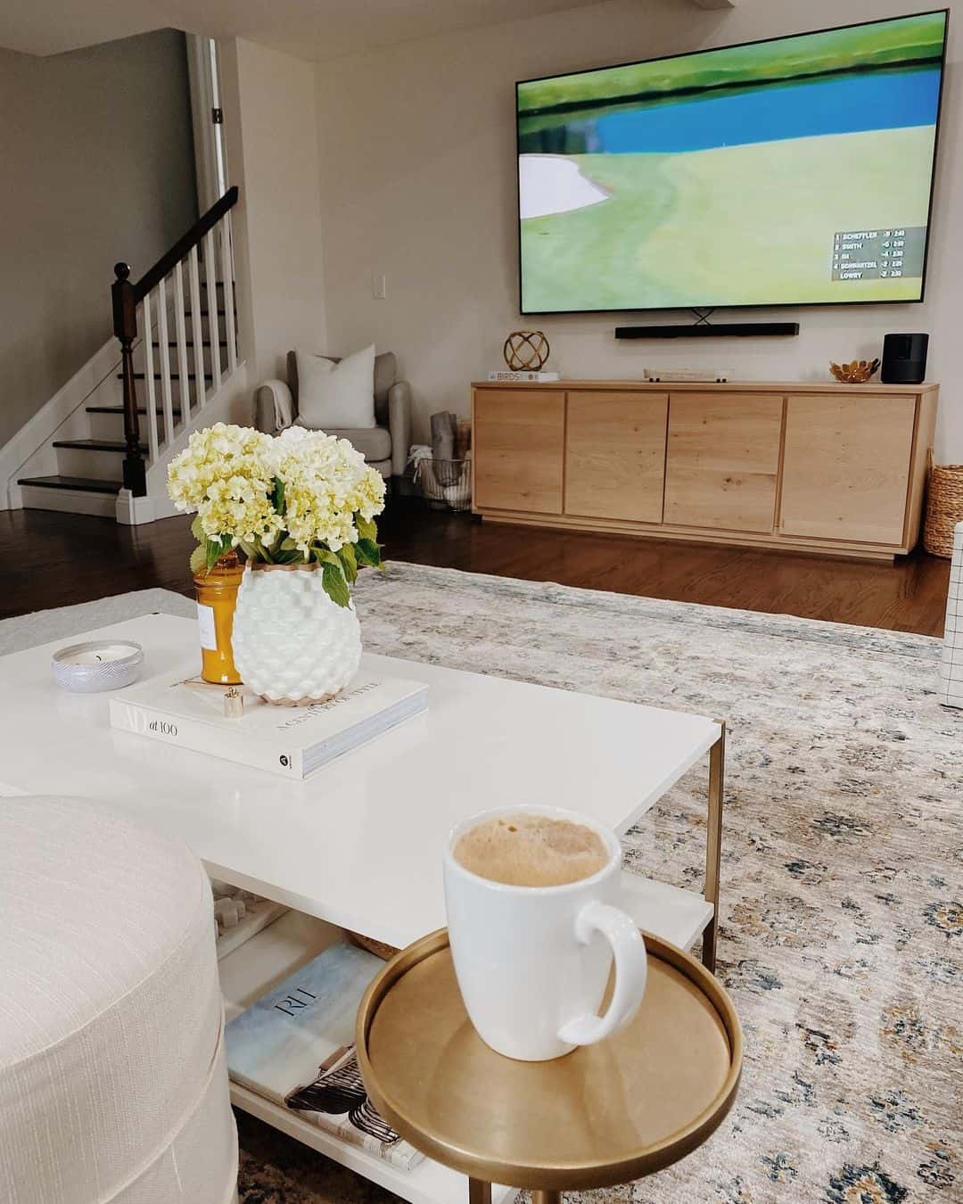 Light Wood Media Console Hides Clutter Below Mounted TV