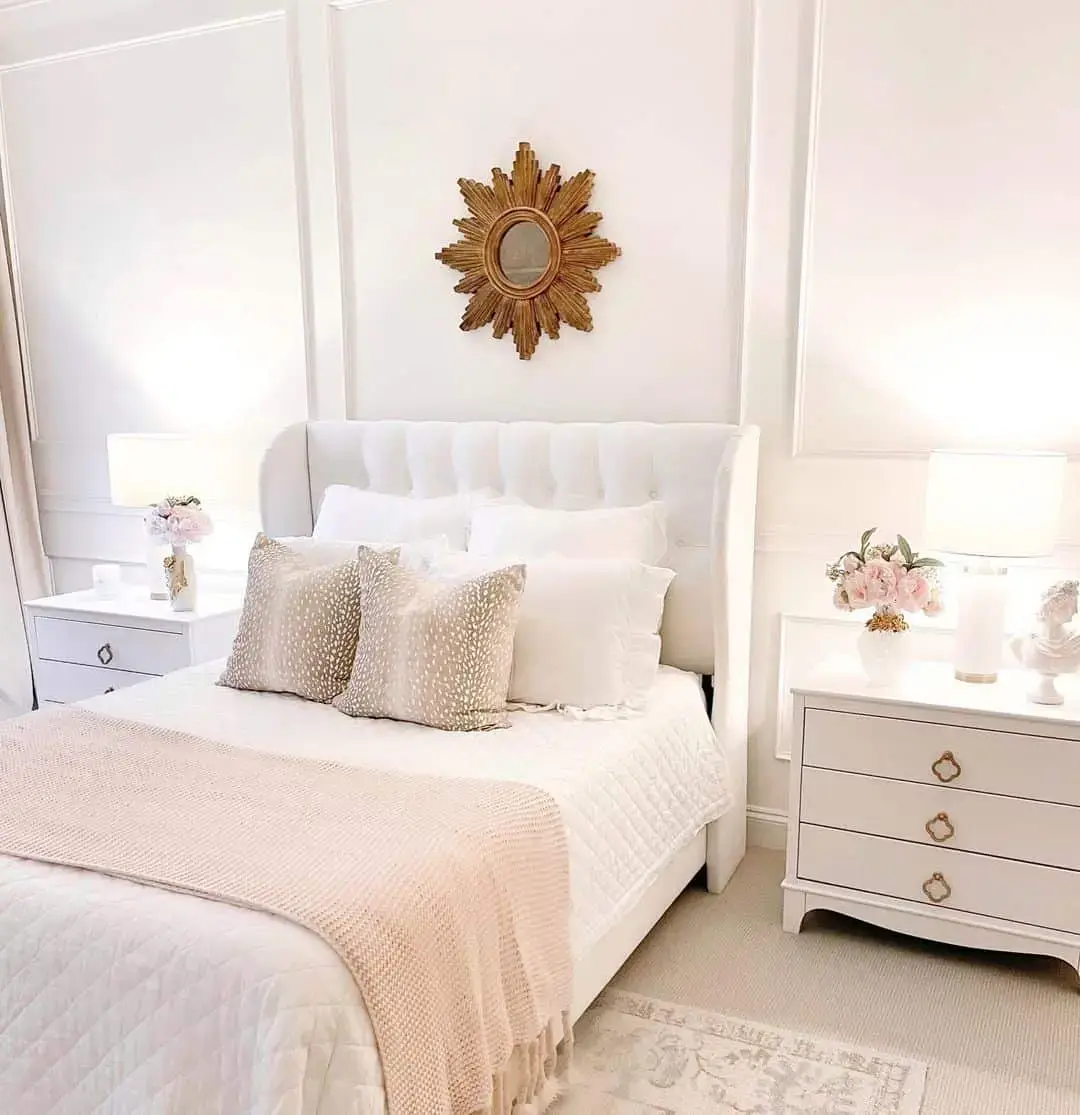 Sunburst Mirror Adds Glamour Above Tufted Headboard