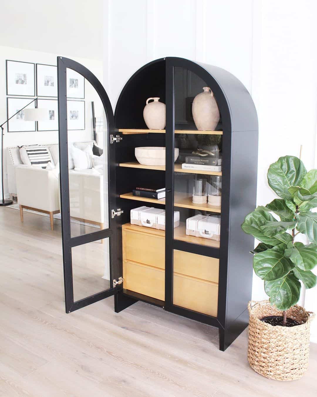 Arched Black Cabinet with Natural Wood Drawers Creates a Statement