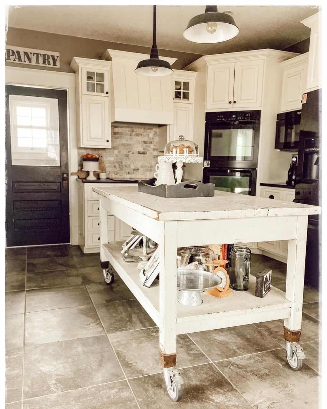 Highlight a Brick Backsplash with White Glass-Front Cabinets