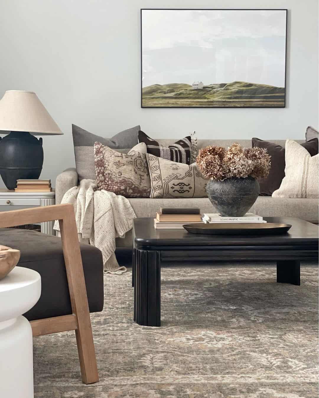 Dark Square Table With Fluted Legs Anchors Seating Area