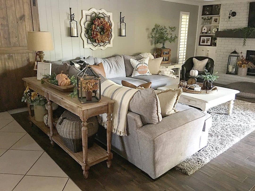 Rustic Console Table Displays Seasonal Accents and Storage Baskets