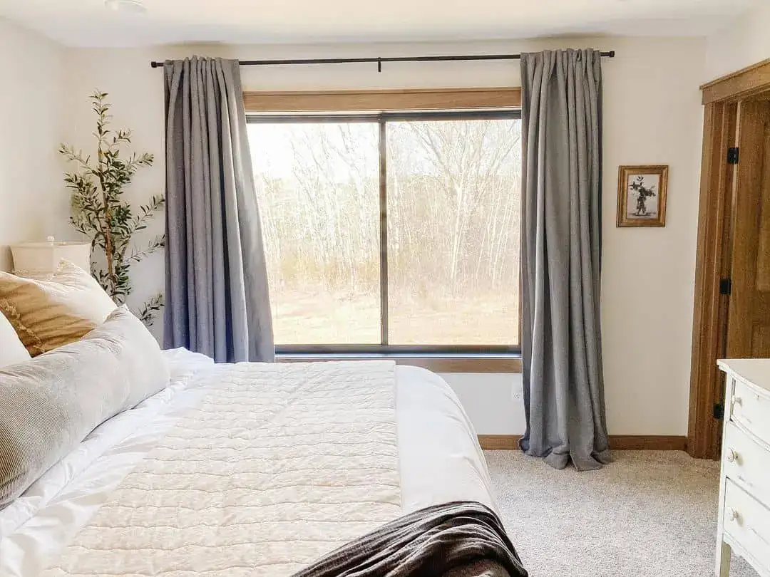 Tall Greenery Adds Organic Height Next to the Bed