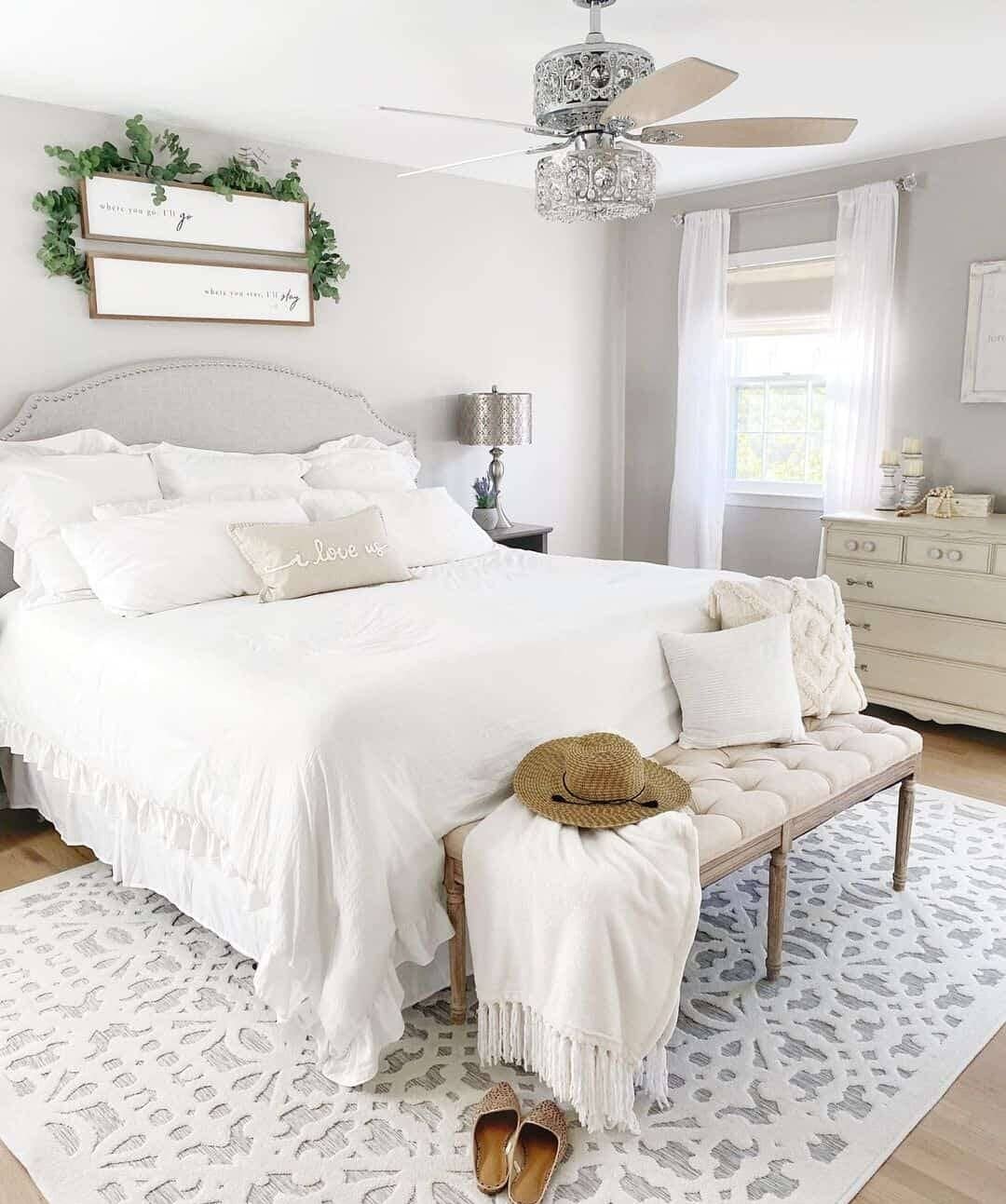 Two Framed Signs Add Personal Touches Above the Bed