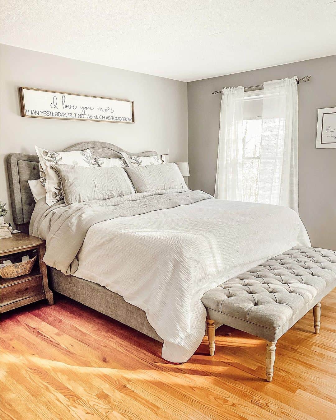 Long Framed Sign Adds a Romantic Statement Above the Bed