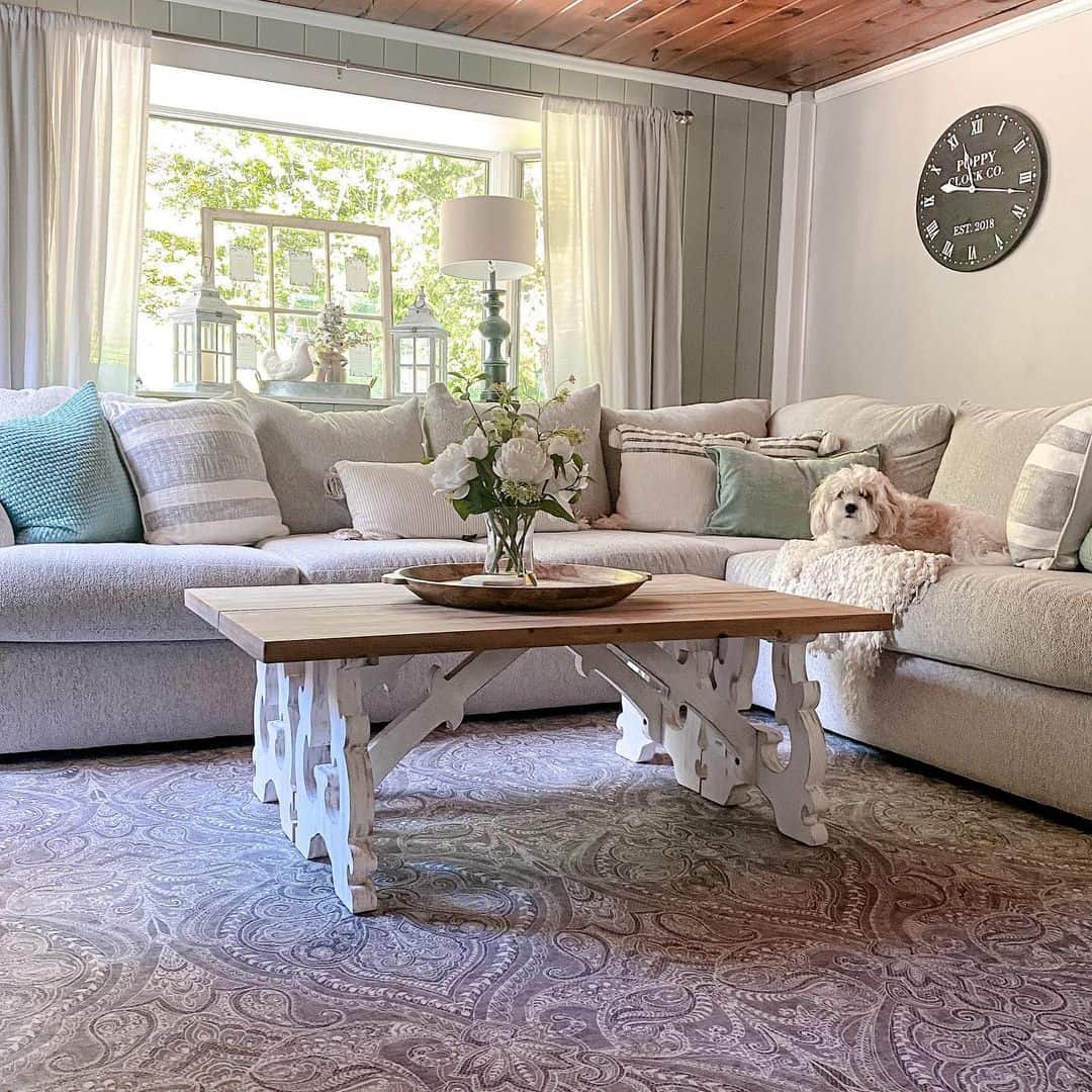Carved White Legs Support a Natural Wood Coffee Table