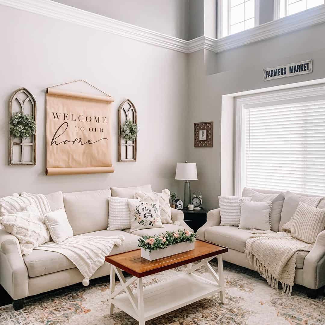 Wood Coffee Table With White X-Frame Base and Floral Centerpiece