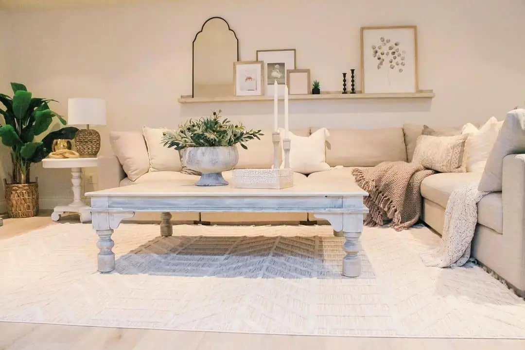 Distressed White Rectangle Table Anchors a Neutral Living Room