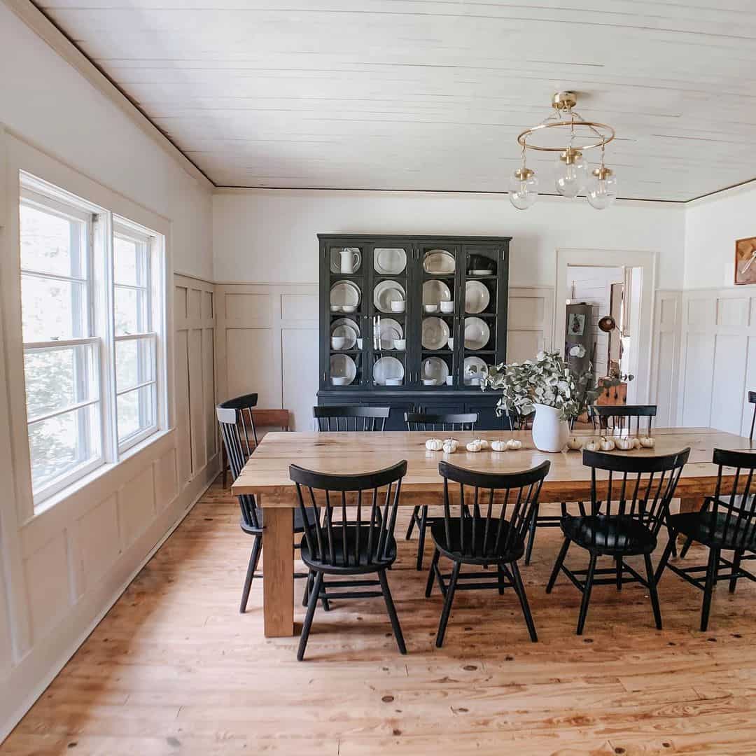 Dark Hutch Displays Plates As Dining Room Focal Point
