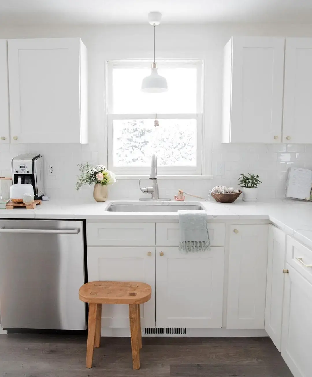 Wooden Stool Adds Rustic Warmth to White Kitchen