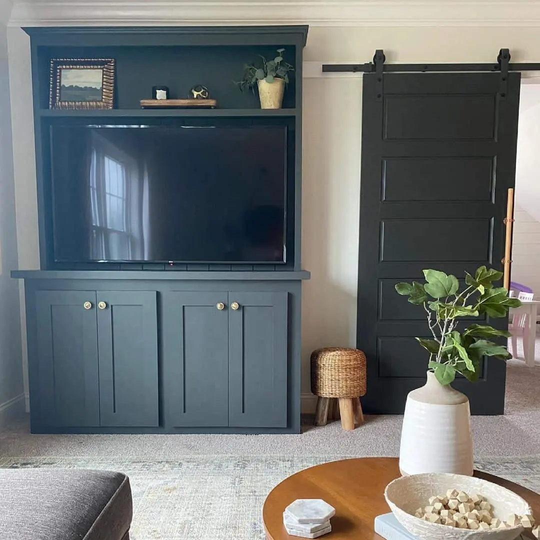 Deep Blue Built-Ins with Brass Hardware Frame Your TV