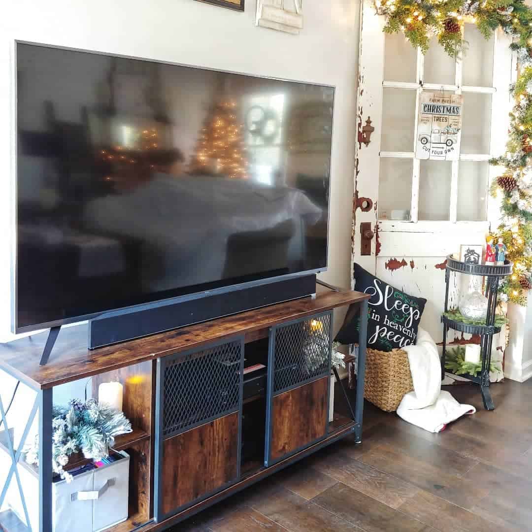 Industrial Console Features Mesh Doors and Rustic Wood Accents