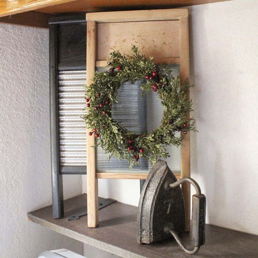 Vintage Washboard Frames a Boxwood and Berry Wreath