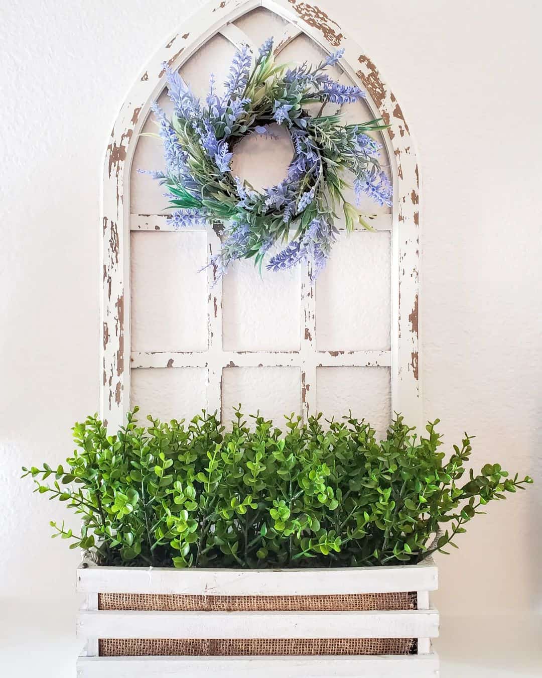 Distressed Cathedral Window Frame Holds a Boxwood Display