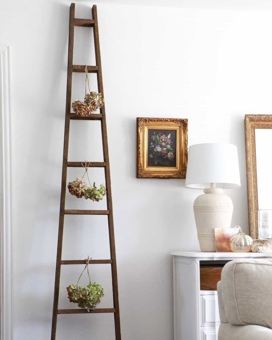 Wooden Ladder Displays Dried Hydrangea Wreaths in Clusters
