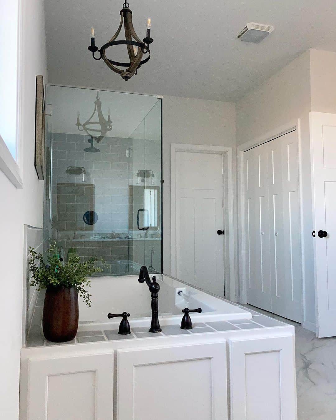 Wooden Vase Holds Greenery Near Bathtub