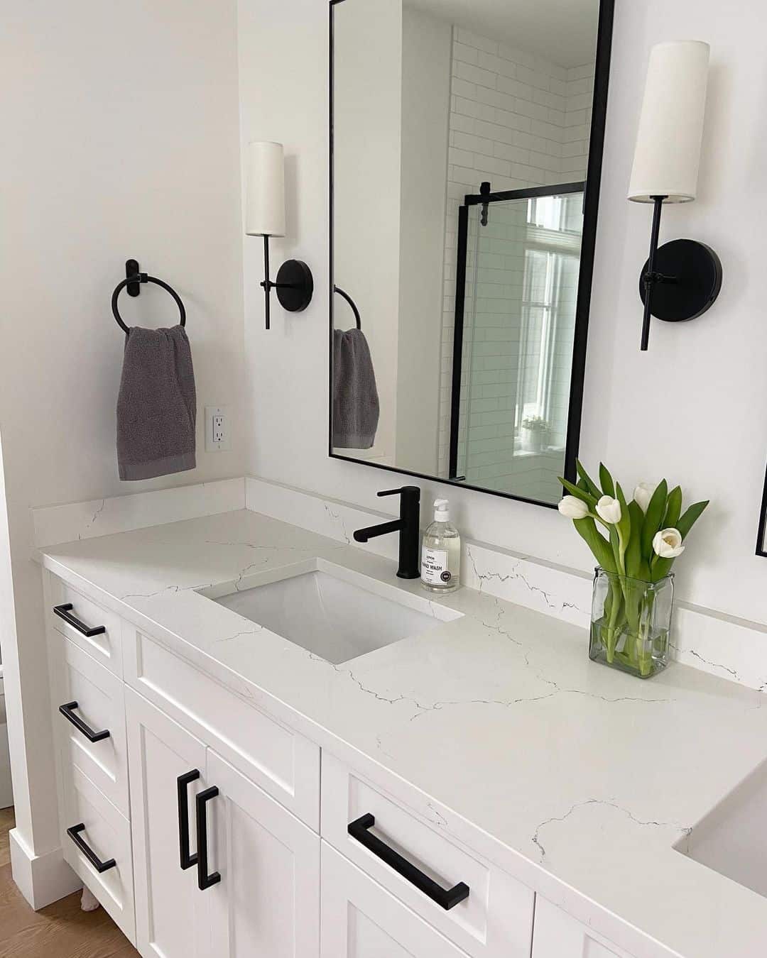 Flank Your Mirror with Black Sconce Lights