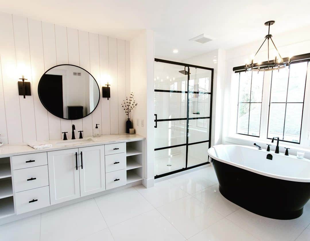 Black Freestanding Tub Adds Dramatic Contrast to White Bathroom