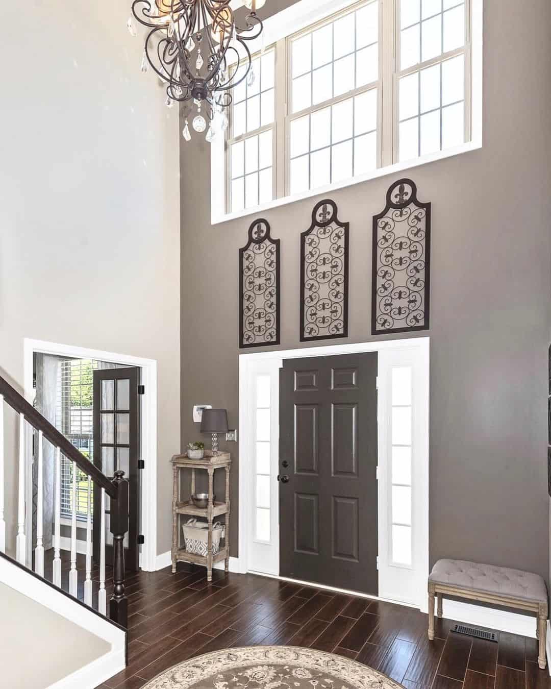 Tall Metal Wall Panels Add Dramatic Verticality Above the Door