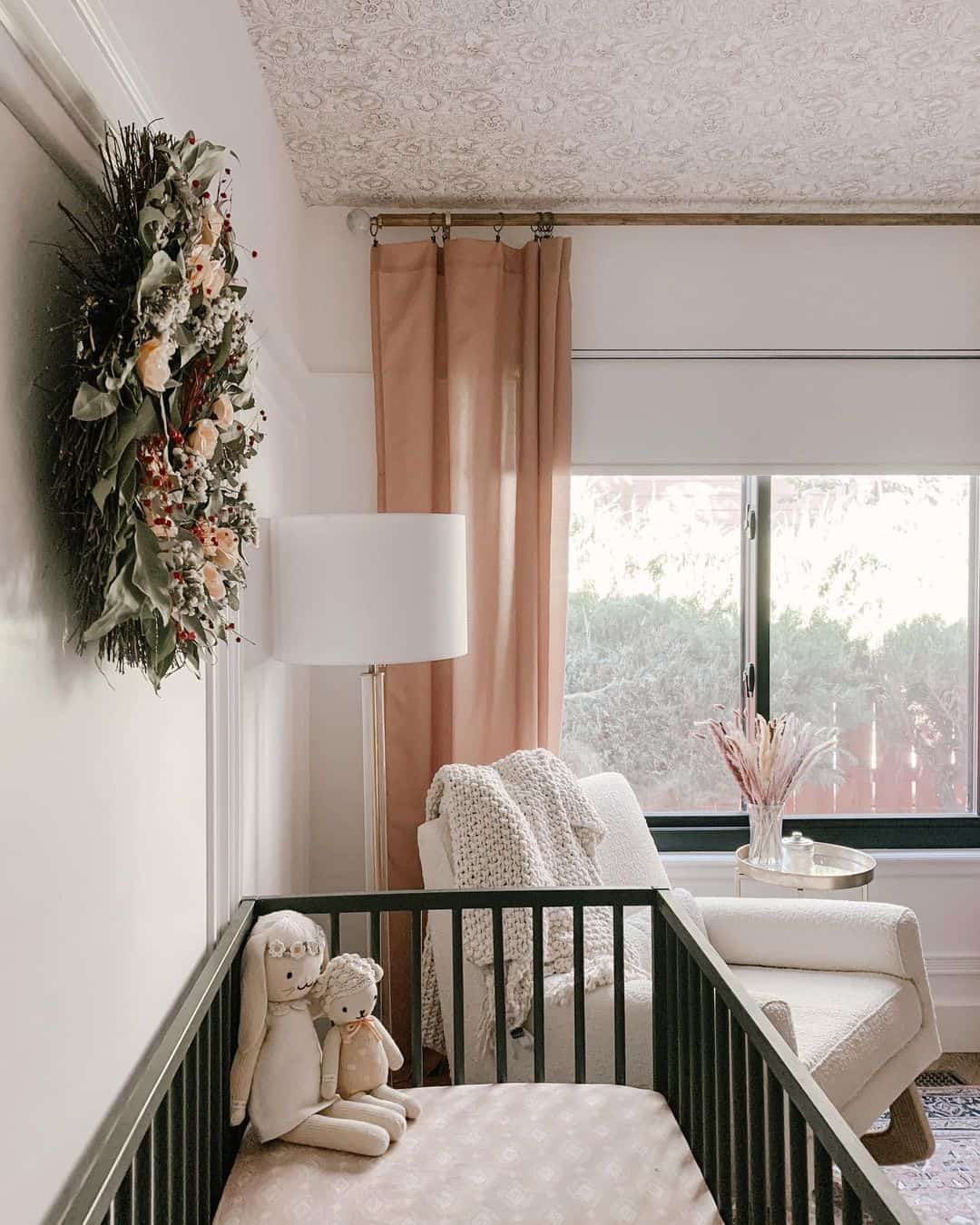 Vertical Floral Garland Adds Whimsical Texture Above Crib